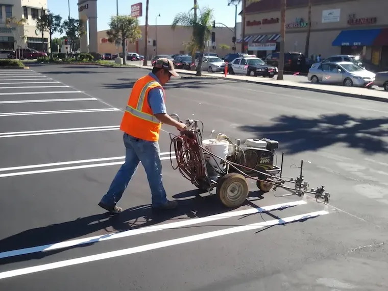 Fresh parking stall lines and ADA accessible spaces striped on an Atlanta commercial lot